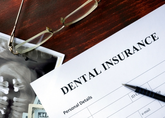 Dental insurance paperwork on desk