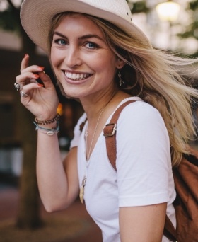 Woman in sunhat and backpack