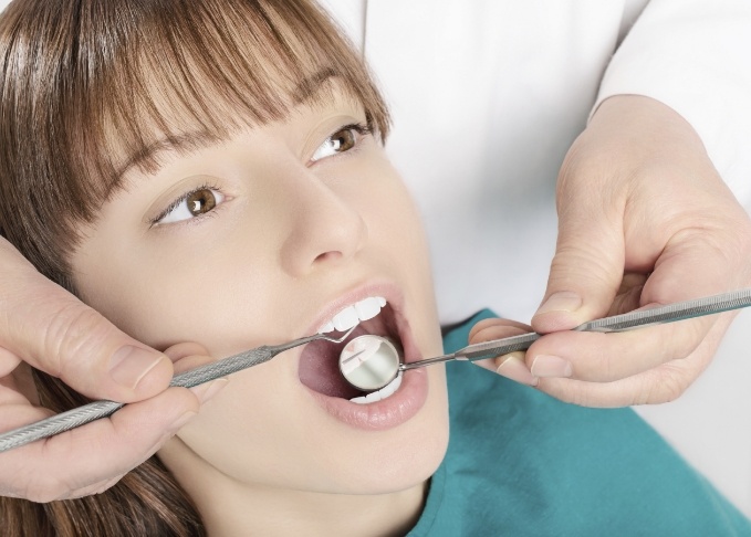 Young woman receiving a preventive dentistry checkup